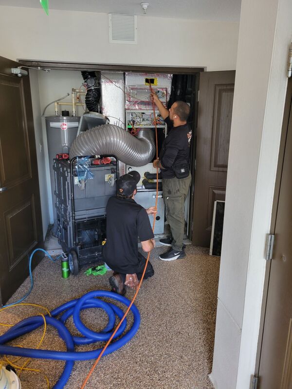 2 HVAC technicians working on Commercial HVAC air duct cleaning
